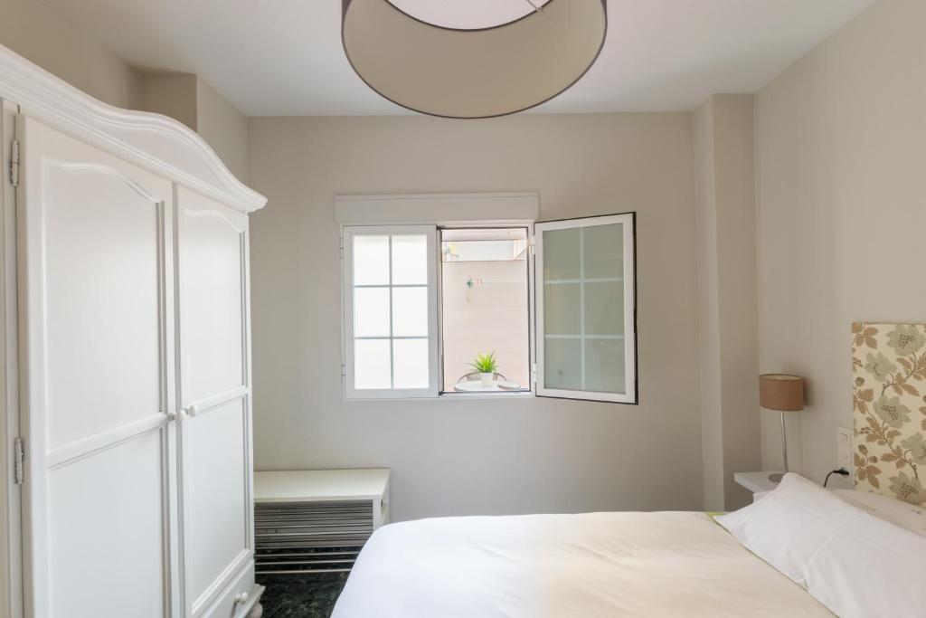A bed or beds in a room at Apartamento valencia centro
