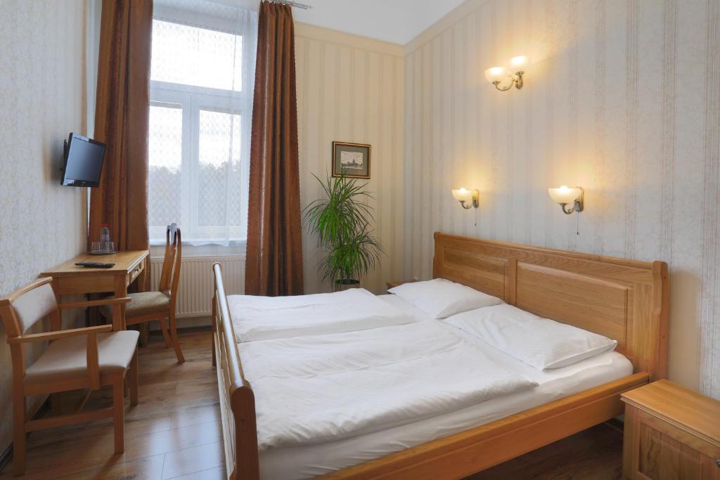 Postel nebo postele na pokoji v ubytování Hotel Štekl - Hrubá Skála