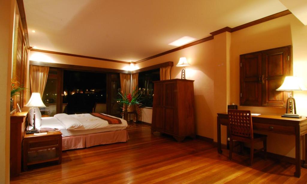 Postel nebo postele na pokoji v ubytování Andamania Beach Resort, Khaolak - SHA plus