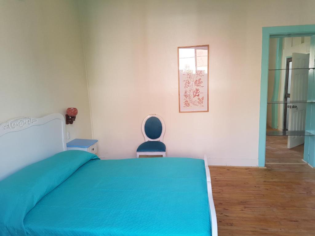 Postel nebo postele na pokoji v ubytování Hostal Casa Aborigen