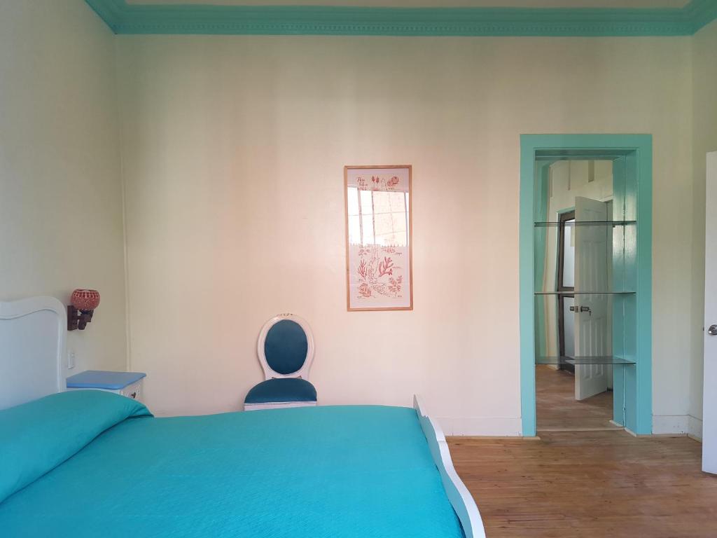 Postel nebo postele na pokoji v ubytování Hostal Casa Aborigen