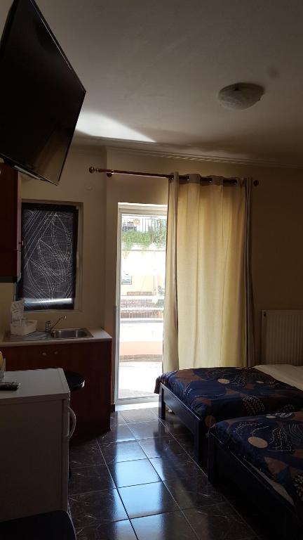 Postel nebo postele na pokoji v ubytování ALEXANDER Rooms