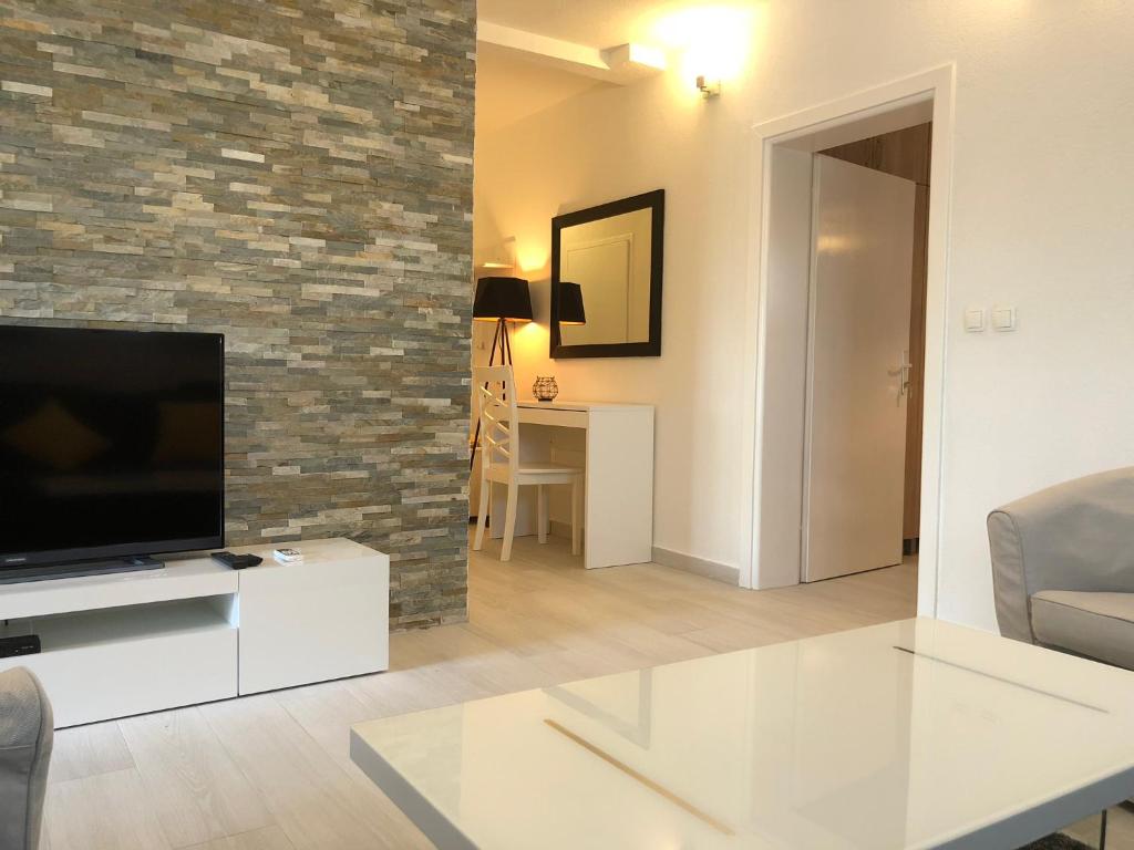TV a/nebo společenská místnost v ubytování Apartmani Učka