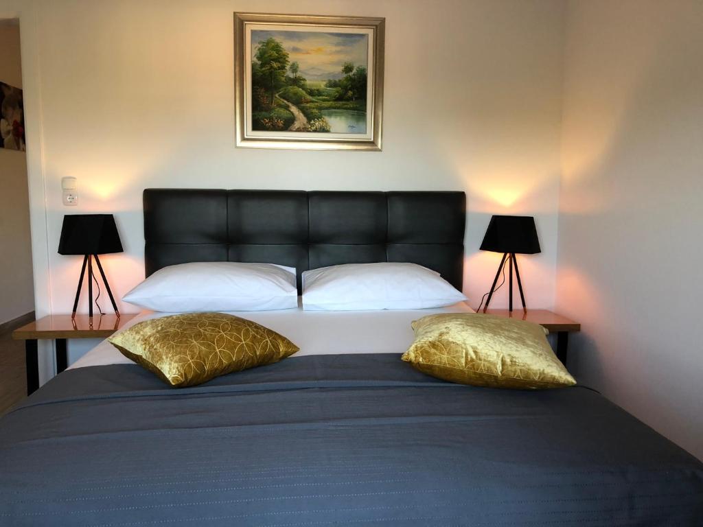 Postel nebo postele na pokoji v ubytování Apartmani Učka