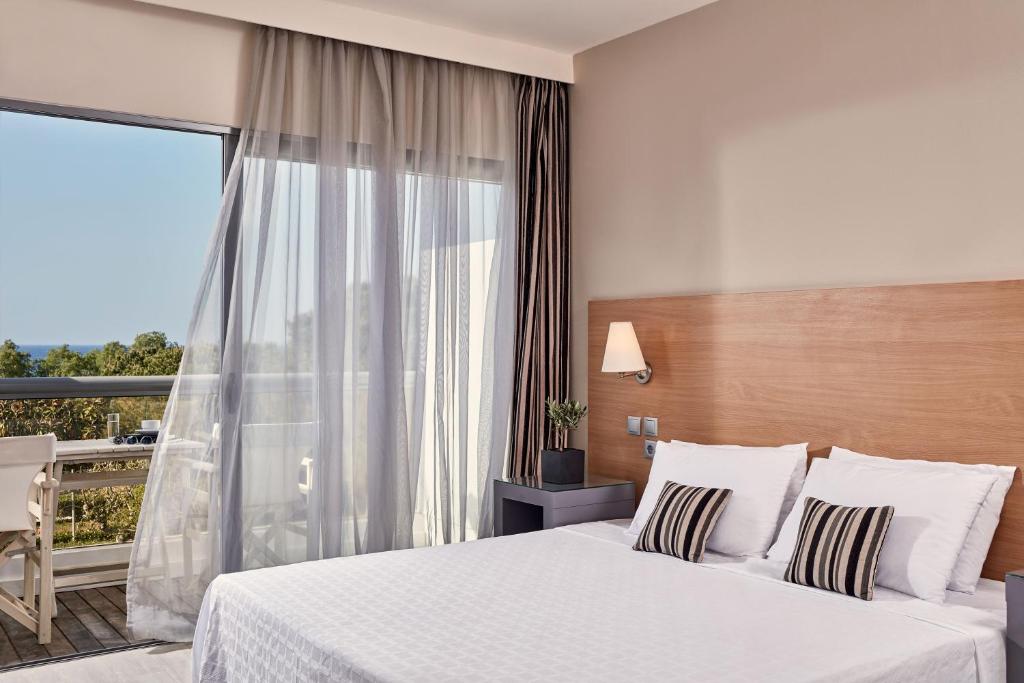 A bed or beds in a room at All Senses Ocean Blue Sea Side Resort - All Inclusive