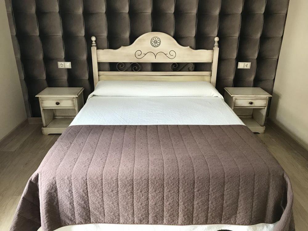 Postel nebo postele na pokoji v ubytování HOSTAL-CAFE GUTGRECO