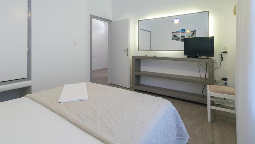 Łóżko lub łóżka w pokoju w obiekcie Giannoulis Hotel