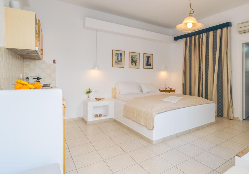 Łóżko lub łóżka w pokoju w obiekcie Giannoulis Hotel