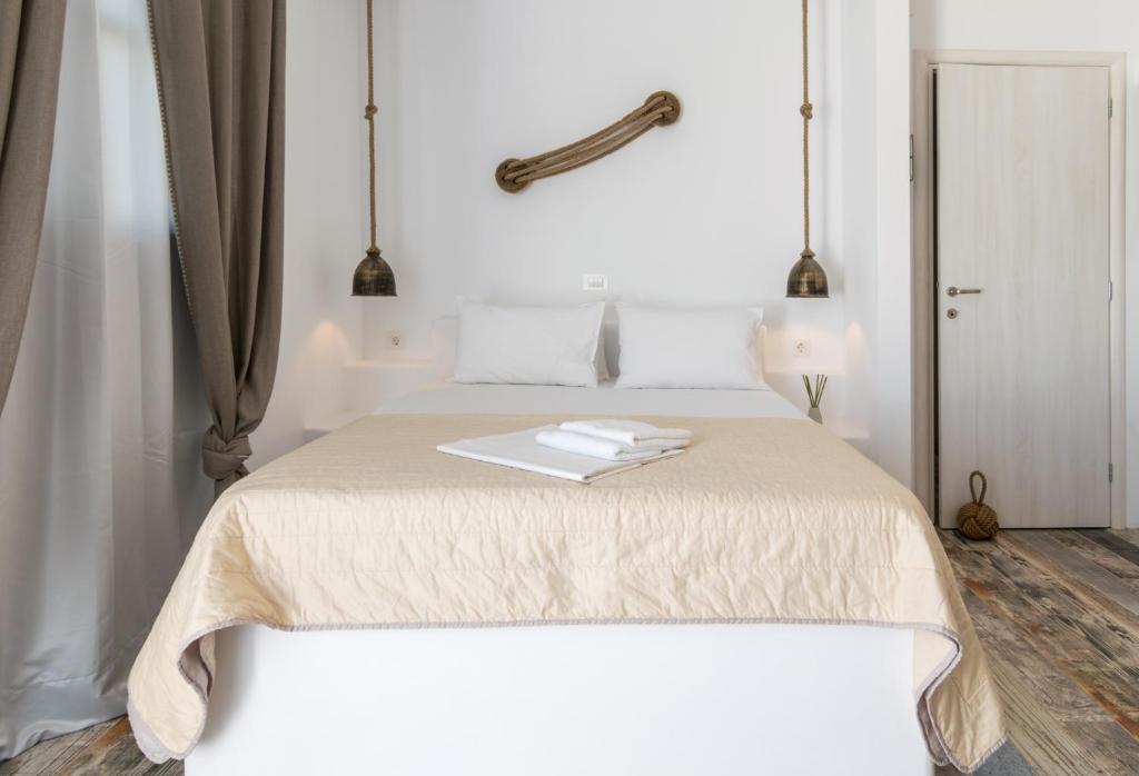 Łóżko lub łóżka w pokoju w obiekcie Giannoulis Hotel