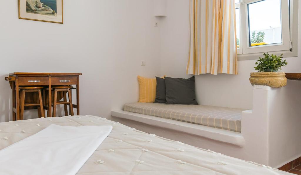 Łóżko lub łóżka w pokoju w obiekcie Giannoulis Hotel