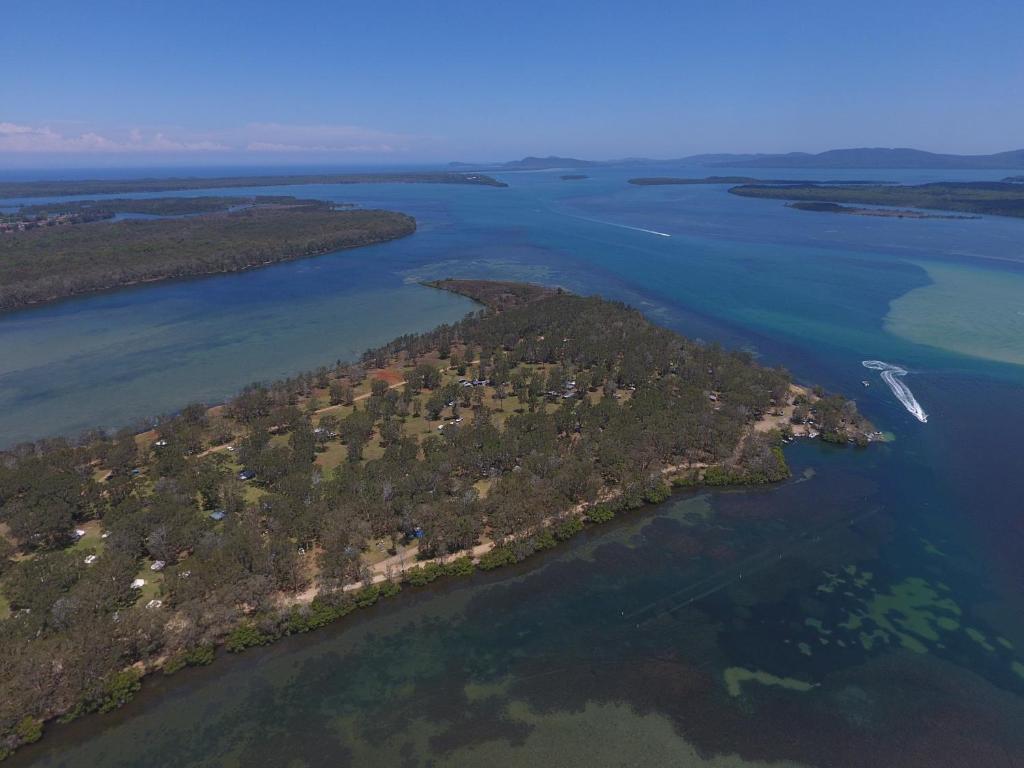an island in the middle of a river at Lani's Holiday Island in Forster