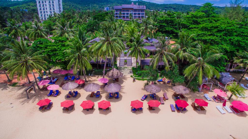 an aerial view of a beach with chairs and umbrellas at Tropicana Resort Phu Quoc in Phú Quốc
