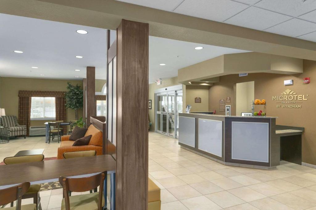 a lobby of a hospital with a waiting room at Microtel Inn & Suites by Wyndham Minot in Minot