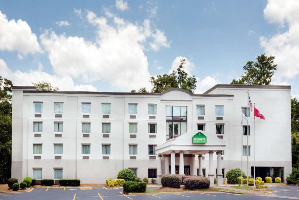 an image of the front of a hotel at Wingate by Wyndham Athens GA in Athens