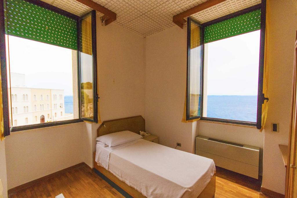 Postel nebo postele na pokoji v ubytování Albergo Palazzo