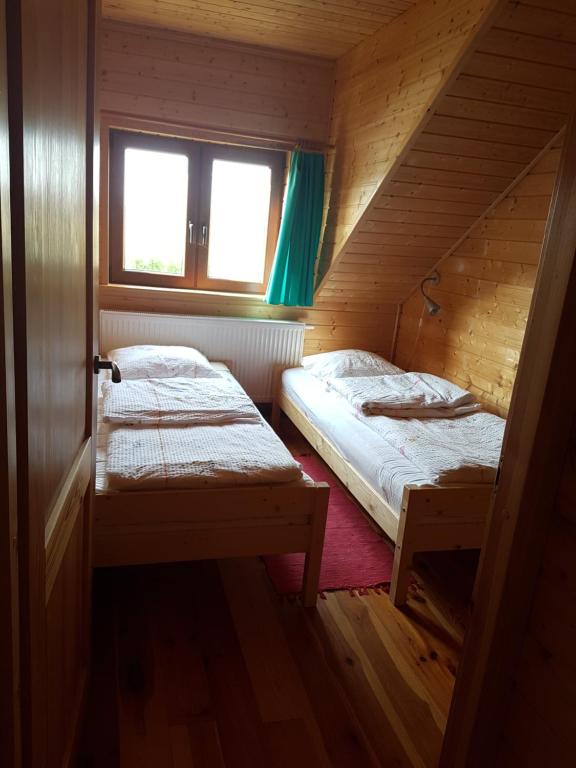 Postel nebo postele na pokoji v ubytování Cztery Pory Roku