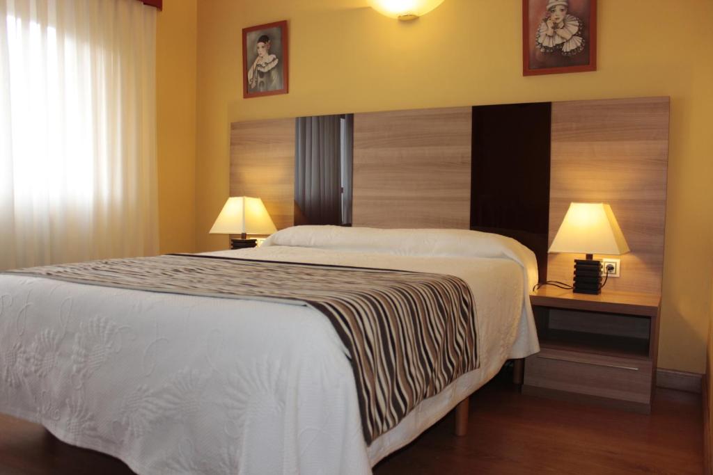 Postel nebo postele na pokoji v ubytování Hotel Peñagrande