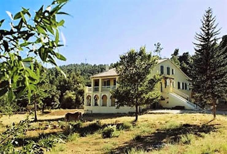 a large white house in the middle of a field at Gite Saint CLAIR - Escapade à Signes in Signes