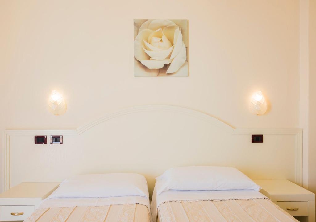 Postel nebo postele na pokoji v ubytování Hotel Fenice Gluten Free