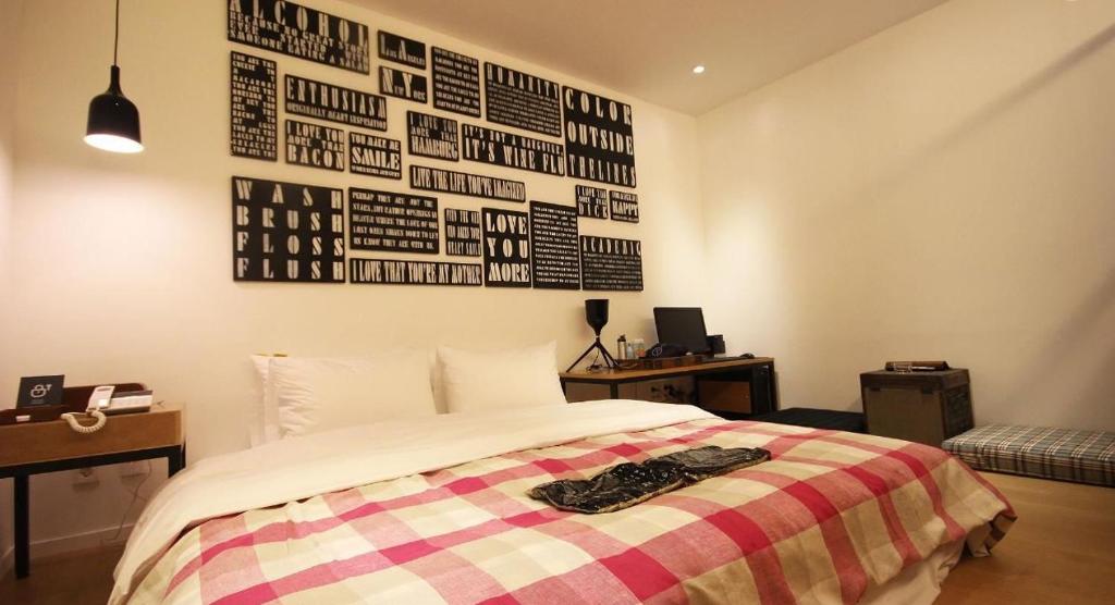 Postel nebo postele na pokoji v ubytování Hotel 25 Seomyeon
