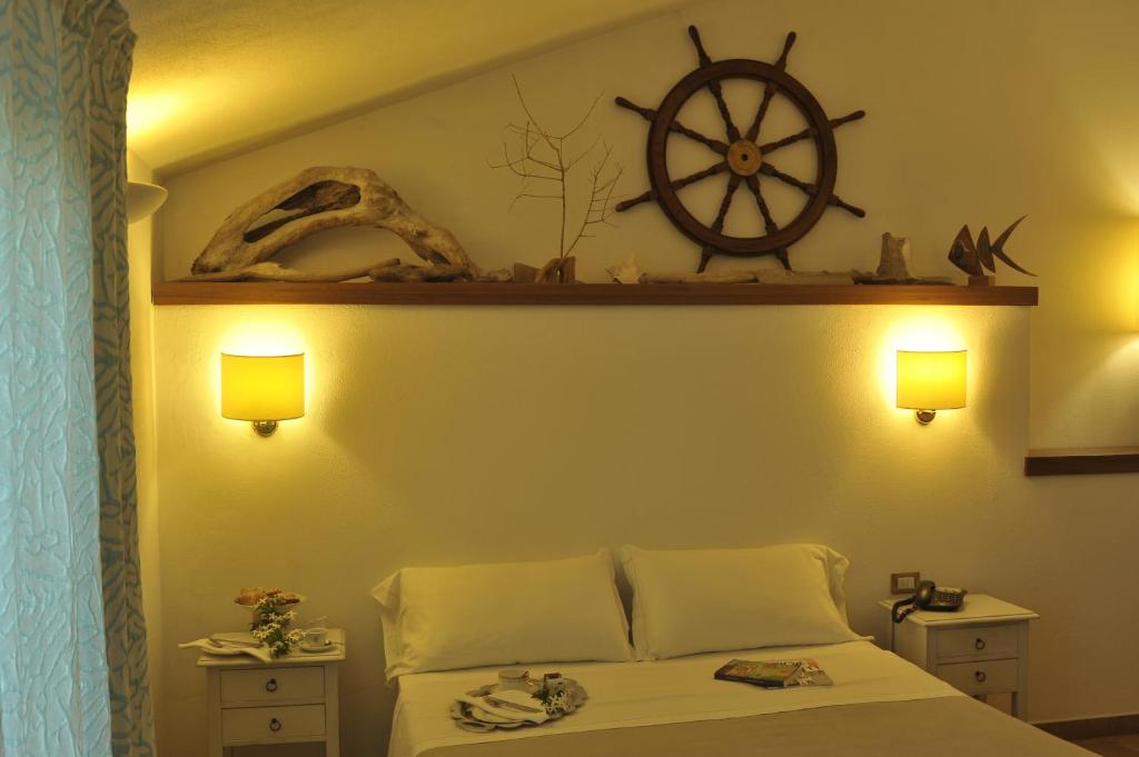 Postel nebo postele na pokoji v ubytování Hotel Villa Pimpina