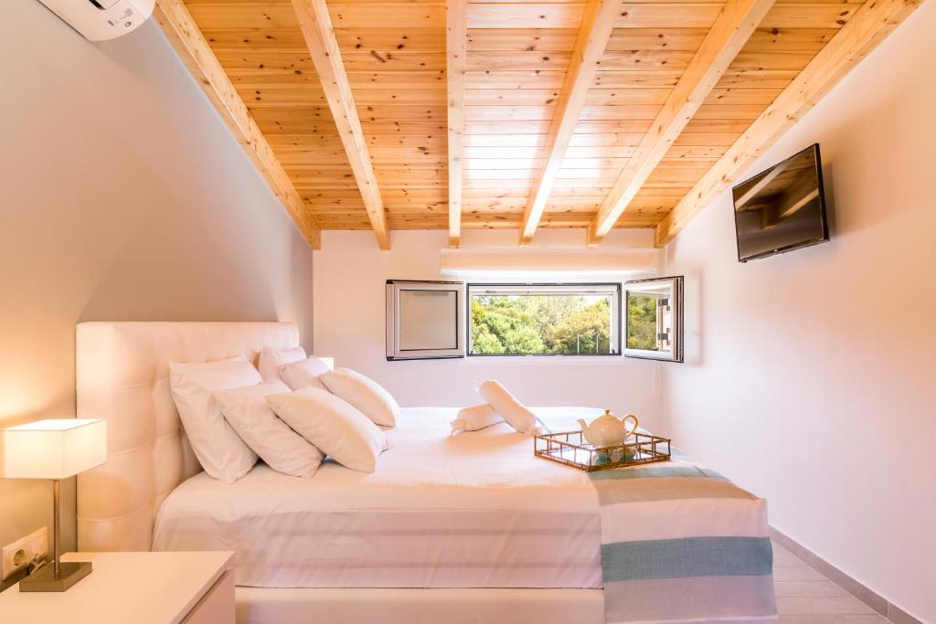 A bed or beds in a room at Villa Johnnie