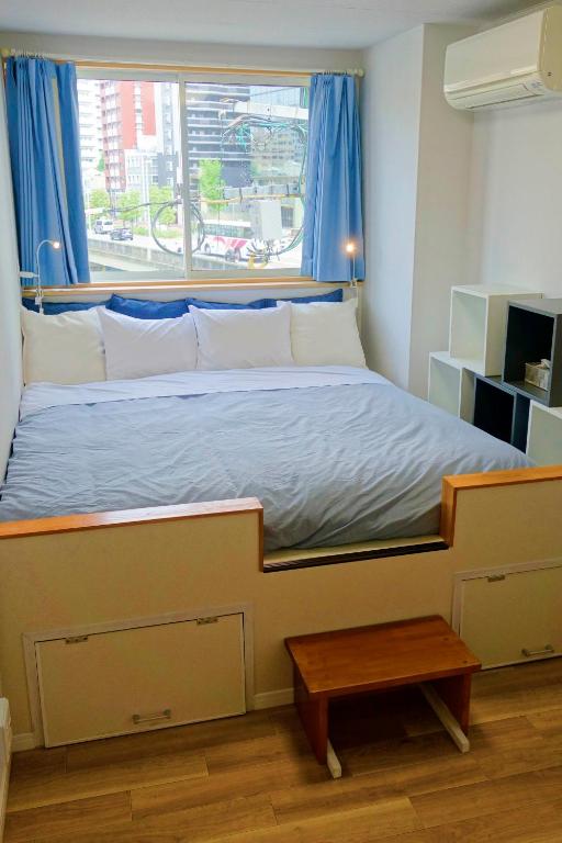 Postel nebo postele na pokoji v ubytování Fukuoka Tabiji Hostel & Guesthouse