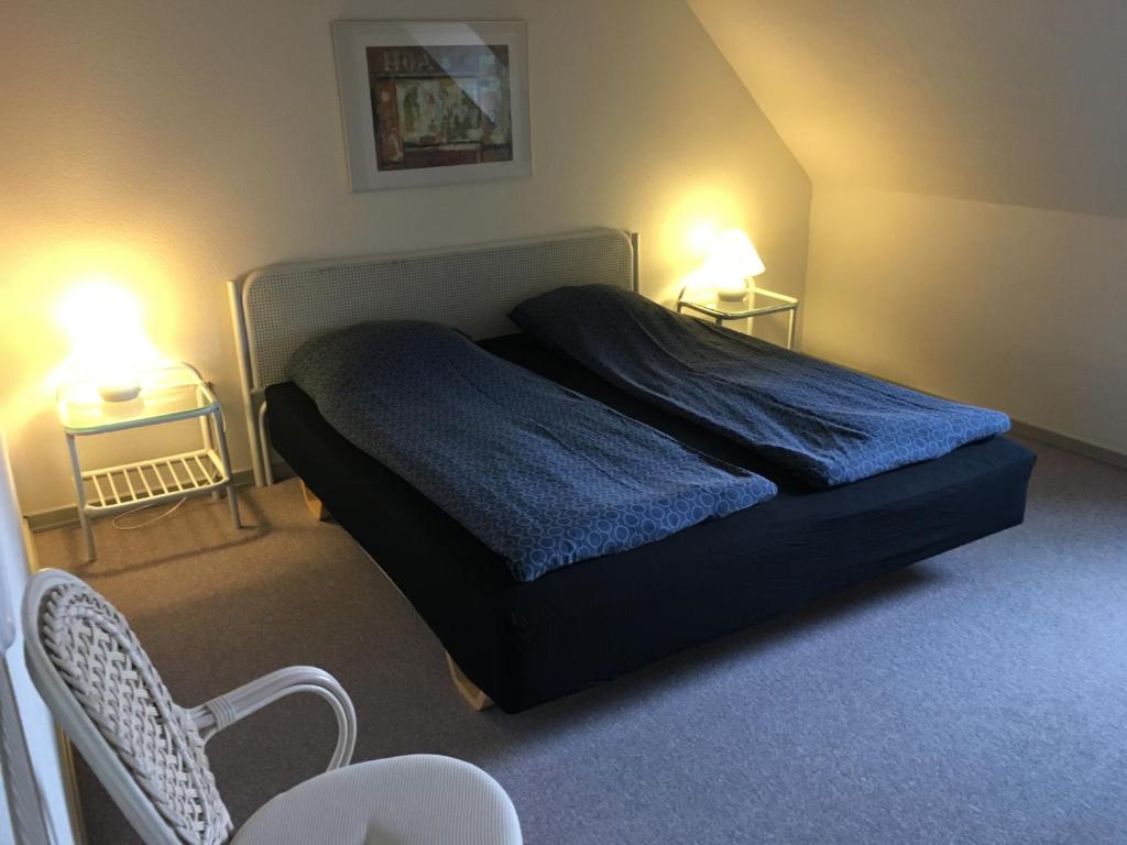 Postel nebo postele na pokoji v ubytování Løkken Badehotel Apartments