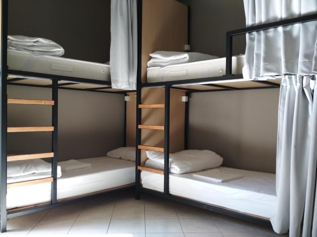 Postel nebo postele na pokoji v ubytování So Young Hostel