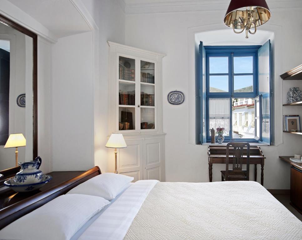 Postel nebo postele na pokoji v ubytování Orloff Boutique Hotel