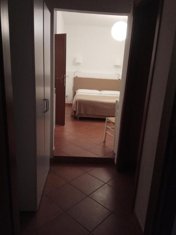 Posteľ alebo postele v izbe v ubytovaní Gemini Appartamenti