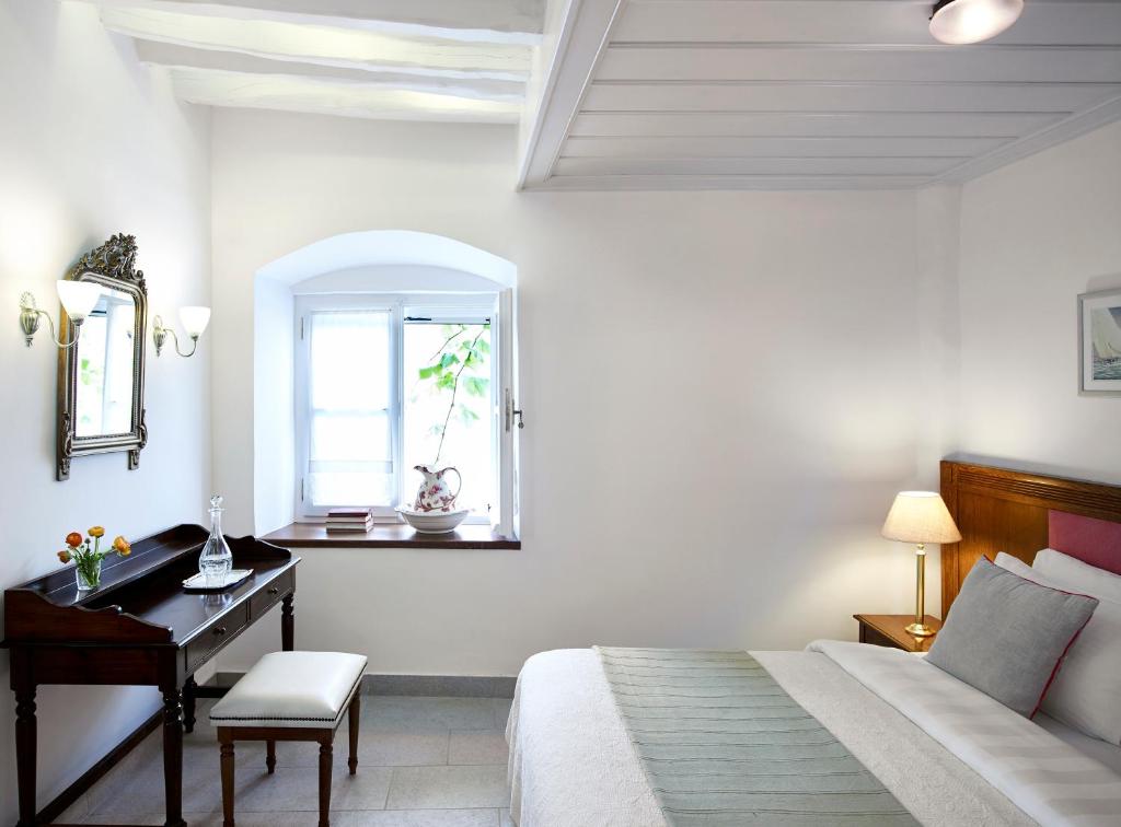 Postel nebo postele na pokoji v ubytování Orloff Boutique Hotel