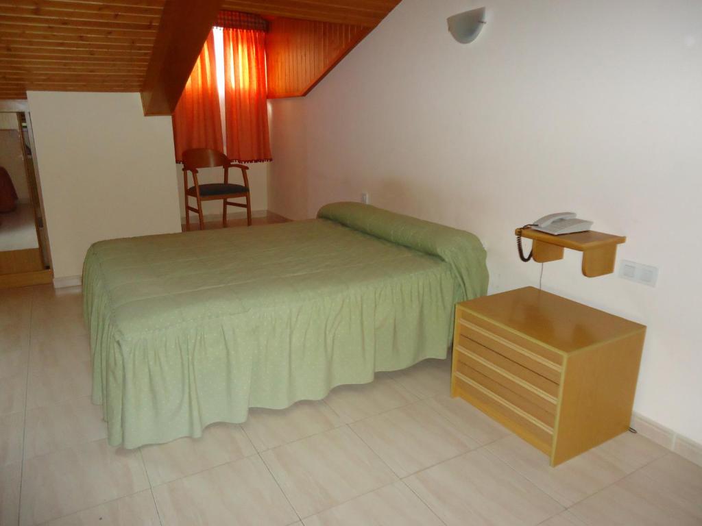 Postel nebo postele na pokoji v ubytování Hotel Silos 2000