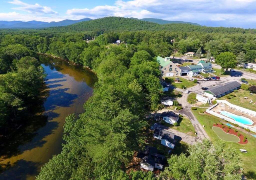 an aerial view of a resort with a river at Merrill Farm Inn in North Conway