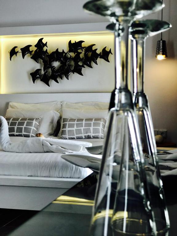 Postel nebo postele na pokoji v ubytování IONIAN SUITES by Bruskos