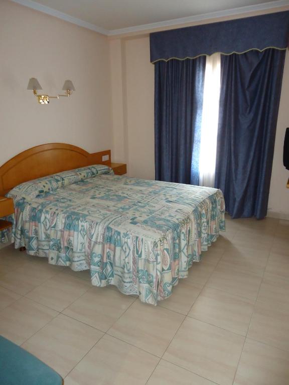 Postel nebo postele na pokoji v ubytování Hotel Silos 2000
