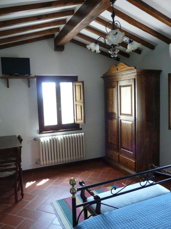 Postel nebo postele na pokoji v ubytování Podere Del Griccia
