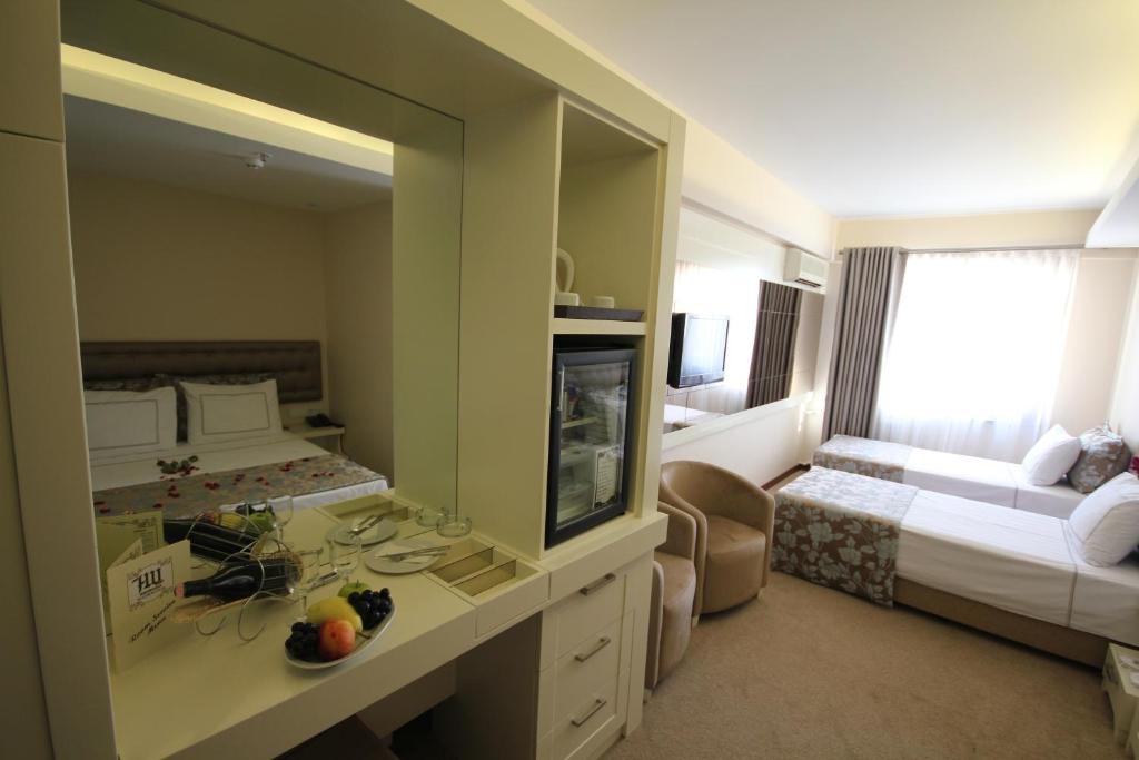 Postel nebo postele na pokoji v ubytování Grand Washington Hotel