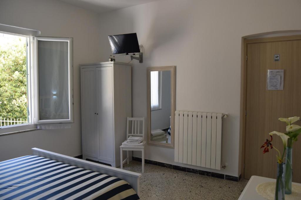 Postel nebo postele na pokoji v ubytování Levante Blu