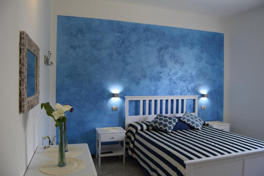 Postel nebo postele na pokoji v ubytování Levante Blu