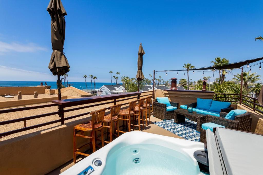 a bath tub on the roof of a resort with the beach at Rooftop Deck Spectacular Ocean View M-A in Oceanside