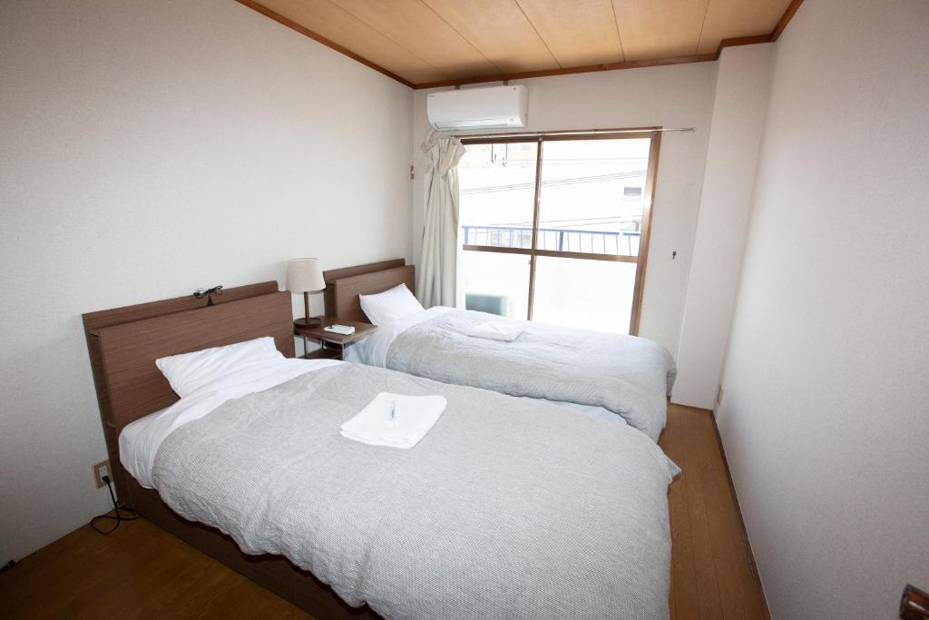 Postel nebo postele na pokoji v ubytování Lazy House