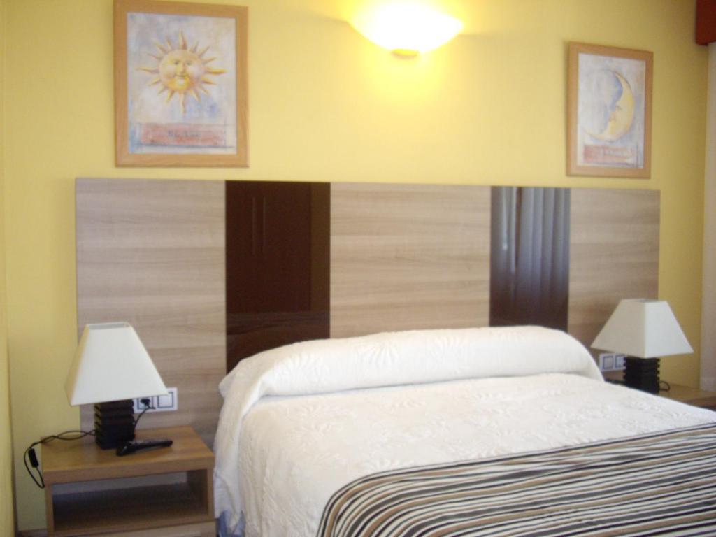 Postel nebo postele na pokoji v ubytování Hotel Peñagrande