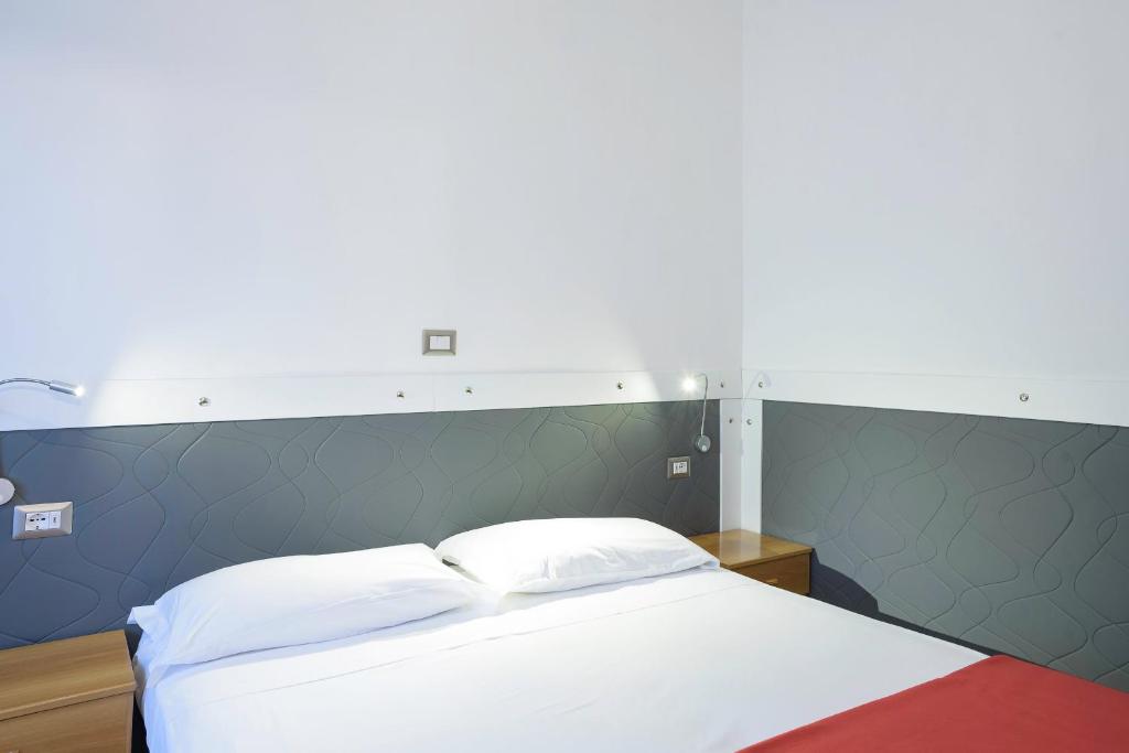 Postel nebo postele na pokoji v ubytování Hotel Doria