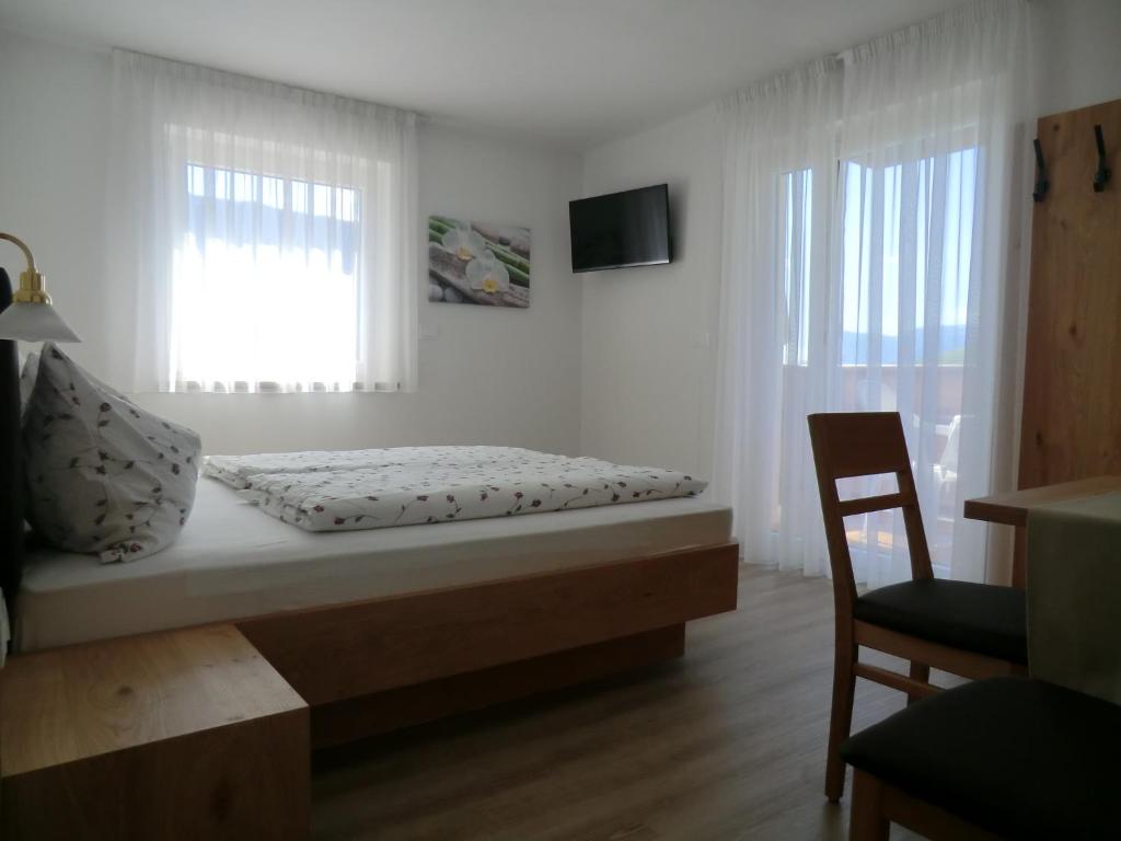 Postel nebo postele na pokoji v ubytování Garni Pircher