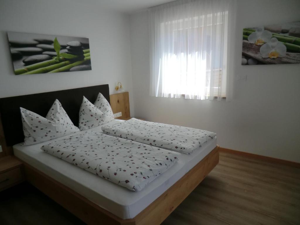 Postel nebo postele na pokoji v ubytování Garni Pircher