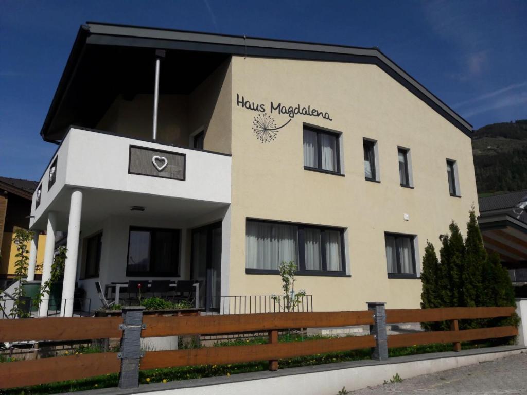 a building with a sign on the side of it at Haus Magdalena in Piesendorf