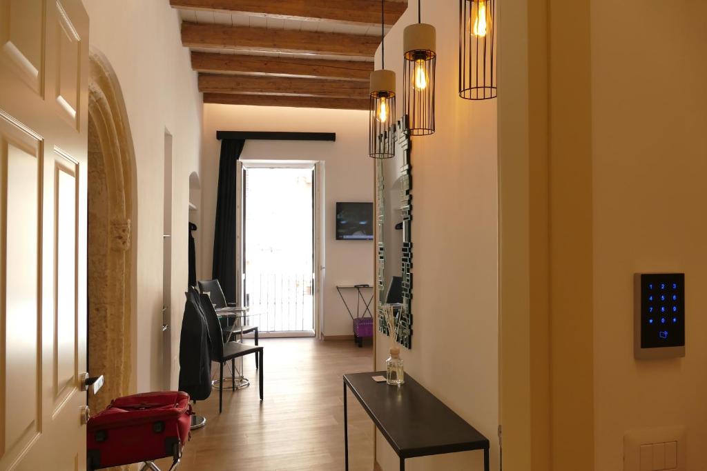 Televízia a/alebo spoločenská miestnosť v ubytovaní MYO Cagliari Charming House