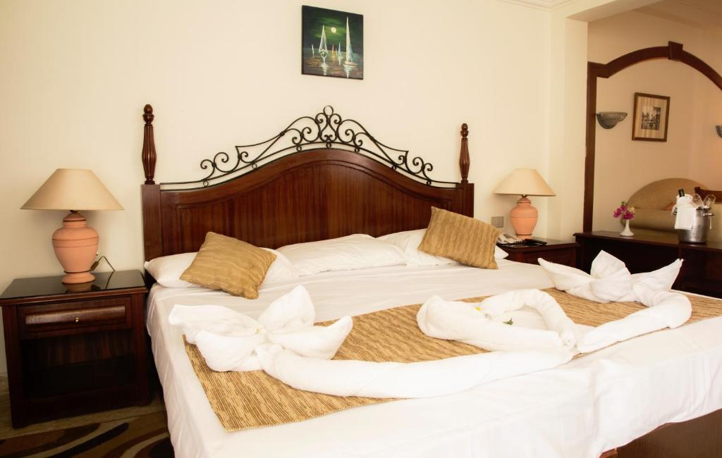Postel nebo postele na pokoji v ubytování Cataract Layalina Naama Bay