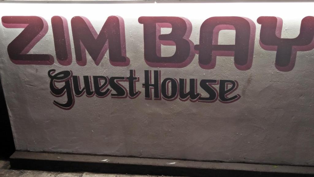 a sign that says zim bar guest house at ZIMBAY Guest House in Arugam Bay